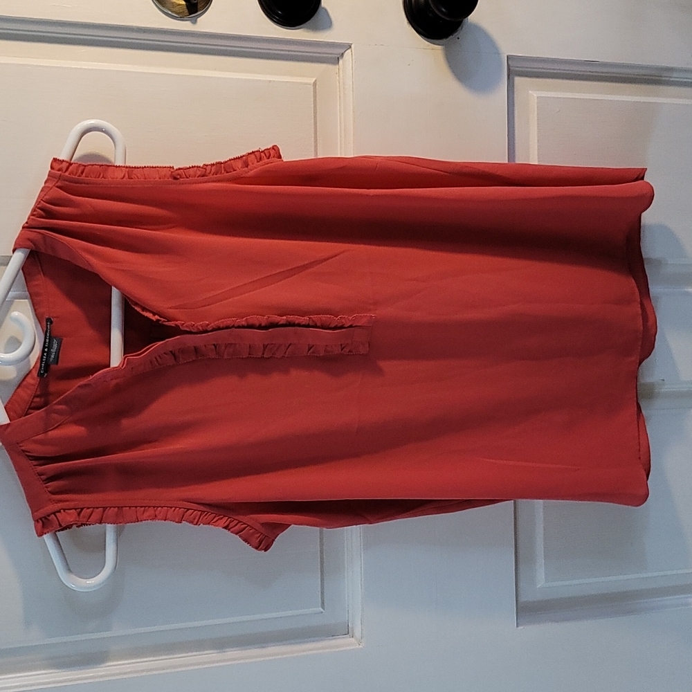 Pink sleeveless blouse